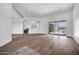 Bright living room featuring hardwood floors, recessed lighting, and a sliding glass door to outdoor area at 30600 N Pima Rd # 24, Scottsdale, AZ 85266