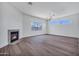 Bright living room with fireplace, recessed lighting, and picture windows at 30600 N Pima Rd # 24, Scottsdale, AZ 85266
