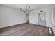 Open-concept living room with hardwood floors and built-in wet bar at 30600 N Pima Rd # 24, Scottsdale, AZ 85266