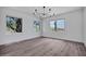 Bright living room features hardwood flooring and large windows showcasing desert views at 30600 N Pima Rd # 24, Scottsdale, AZ 85266