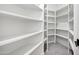 Walk-in pantry features white shelving for ample storage space at 30600 N Pima Rd # 24, Scottsdale, AZ 85266