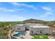 Stunning home showcasing a private pool, patio, and serene desert landscape in the backyard at 30600 N Pima Rd # 24, Scottsdale, AZ 85266
