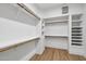 Spacious walk-in closet with custom shelving, rods, and drawers for optimal organization at 30600 N Pima Rd # 24, Scottsdale, AZ 85266