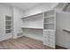 Bright walk-in closet boasts custom shelving, drawers, and ample rod space at 30600 N Pima Rd # 24, Scottsdale, AZ 85266