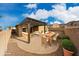 Backyard patio with pergola has a dining table and outdoor seating on pavers at 34705 N 26Th Ave, Phoenix, AZ 85086