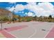 Outdoor basketball court with neighborhood homes and desert landscape in background at 34705 N 26Th Ave, Phoenix, AZ 85086