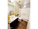 Bathroom featuring a shower-tub combo, a tile floor, single sink, and a mirror at 34705 N 26Th Ave, Phoenix, AZ 85086