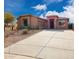 Charming single-story home with desert landscaping, a wide driveway and a two car garage at 34705 N 26Th Ave, Phoenix, AZ 85086