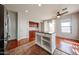 Kitchen with island including bar stool seating, storage, and modern appliances at 34705 N 26Th Ave, Phoenix, AZ 85086