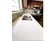 Close-up view of a stainless steel sink and quartz countertop in the kitchen at 34705 N 26Th Ave, Phoenix, AZ 85086