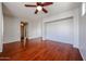 Unfurnished living room with hardwood floors, gray walls, and a ceiling fan at 34705 N 26Th Ave, Phoenix, AZ 85086