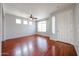 Bright living room with hardwood floors, large window, and white walls at 34705 N 26Th Ave, Phoenix, AZ 85086