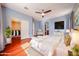 Bright and spacious bedroom featuring a ceiling fan, closet, and access to en suite at 34705 N 26Th Ave, Phoenix, AZ 85086