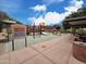 Community playground with play structures, picnic benches, and walkways at 34705 N 26Th Ave, Phoenix, AZ 85086