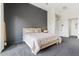 Spacious bedroom featuring a cozy queen bed, soft carpet, and gray accent wall at 37654 N 102Nd Pl, Scottsdale, AZ 85262