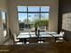 Bright dining area with views of the pool and backyard creating an inviting space at 37654 N 102Nd Pl, Scottsdale, AZ 85262