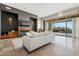 Open-concept living room featuring a fireplace and sliding doors to the patio at 37654 N 102Nd Pl, Scottsdale, AZ 85262