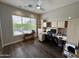 Bright home office with built-in shelving and a large window offering natural light at 37654 N 102Nd Pl, Scottsdale, AZ 85262