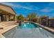 Beautiful pool and patio area offering a relaxing oasis with desert landscaping and seamless integration with the home at 37654 N 102Nd Pl, Scottsdale, AZ 85262