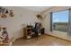 Functional bedroom with a workstation setup and ample natural light from the window at 38413 N 16Th St, Phoenix, AZ 85086