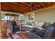 Inviting covered porch with comfortable seating and a ceiling fan for relaxing outdoors at 38413 N 16Th St, Phoenix, AZ 85086