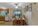 Bright dining area with wooden table set, decorative window coverings, and cozy ambiance at 38413 N 16Th St, Phoenix, AZ 85086