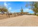 View of the green single-story ranch-style home with a gravel driveway and desert landscaping at 38413 N 16Th St, Phoenix, AZ 85086