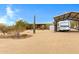 Desert home featuring covered RV parking, mature cacti, and gravel landscape for low maintenance living at 38413 N 16Th St, Phoenix, AZ 85086