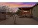 Exterior view of a home with a covered porch, landscaping, and backyard space at 38413 N 16Th St, Phoenix, AZ 85086