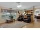 Relaxing living room with comfortable leather recliners, built-in shelving, and natural light at 38413 N 16Th St, Phoenix, AZ 85086