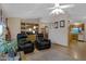 Spacious living room with leather recliners, custom shelving, and an open layout at 38413 N 16Th St, Phoenix, AZ 85086