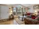 Bright living room featuring a vaulted ceiling, lots of natural light, and modern flooring at 38413 N 16Th St, Phoenix, AZ 85086