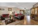 Inviting living room featuring vaulted ceilings, hardwood floors, and modern furniture at 38413 N 16Th St, Phoenix, AZ 85086