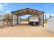 Covered RV parking area with metal frame and gravel base perfect for protecting your vehicle from the elements at 38413 N 16Th St, Phoenix, AZ 85086