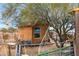 Exterior view of a small studio, featuring an outside sitting area, perfect for artistic endeavors or private relaxation at 38413 N 16Th St, Phoenix, AZ 85086