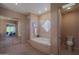 Bathroom featuring a bathtub, vanity, toilet, and mirror doors revealing the primary bedroom at 40262 N 107Th Pl, Scottsdale, AZ 85262