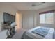 Bedroom with bed, wall mounted tv, and ceiling fan at 40262 N 107Th Pl, Scottsdale, AZ 85262