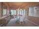 Bright dining area featuring a chandelier, large windows, and an elegant table setting at 40262 N 107Th Pl, Scottsdale, AZ 85262