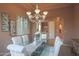 Dining area featuring a glass table, stylish lighting, and serene ambiance at 40262 N 107Th Pl, Scottsdale, AZ 85262