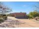 Home featuring an attached two-car garage, beautiful desert landscaping, and a paved driveway at 40262 N 107Th Pl, Scottsdale, AZ 85262