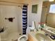 Bathroom featuring shower/tub combo, toilet, a single sink vanity and framed decoration at 4101 E Nancy Ln, Phoenix, AZ 85042