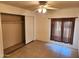 Bedroom featuring a closet, a window with curtains, and neutral paint at 4101 E Nancy Ln, Phoenix, AZ 85042