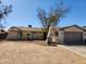 Charming single-story home featuring a unique arched entryway and low maintenance desert landscaping at 4101 E Nancy Ln, Phoenix, AZ 85042