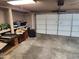 Spacious two car garage featuring ample storage space and clean concrete flooring at 4101 E Nancy Ln, Phoenix, AZ 85042