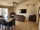 Inviting living room featuring tiled floors, neutral walls, ceiling fan, and a cozy seating area at 4101 E Nancy Ln, Phoenix, AZ 85042