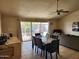 Inviting living room featuring tiled floors, neutral walls, ceiling fan, and a cozy seating area at 4101 E Nancy Ln, Phoenix, AZ 85042