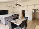 Inviting living room featuring tiled floors, neutral walls, ceiling fan, and a cozy seating area at 4101 E Nancy Ln, Phoenix, AZ 85042