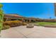 Outdoor space with a firepit, green lawn, and vibrant flowering bushes offering relaxation at 4109 E Del Rio St, Gilbert, AZ 85295