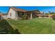 Large backyard with a well-manicured lawn and landscaping, great for outdoor activities at 4109 E Del Rio St, Gilbert, AZ 85295