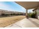 Grassy backyard featuring block wall and covered patio at 4109 E Del Rio St, Gilbert, AZ 85295